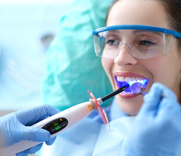 a woamn receving a dental bonding treatment