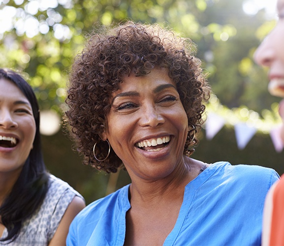 Woman with tooth colored filling sharing flawless smile