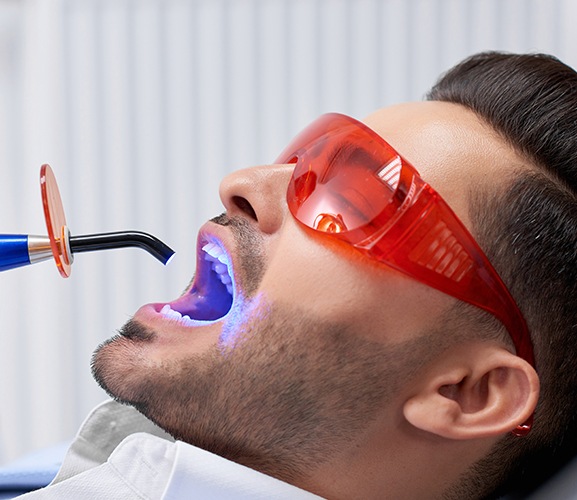 Patient receiving dental bonding cosmetic dentistry treatment