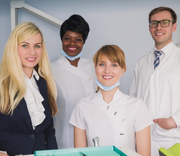 Happy, smiling dental office team