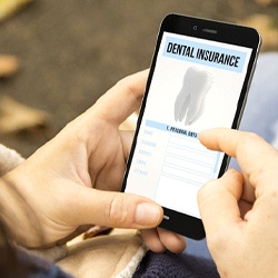 Using mobile phone to look up information about dental insurance