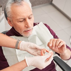 Man getting dentures at the dentist