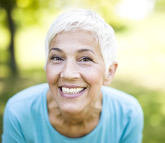 woman with dentures in Dallas grinning from ear to ear