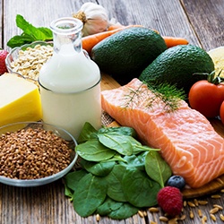 An assortment of healthy foods against a wood background