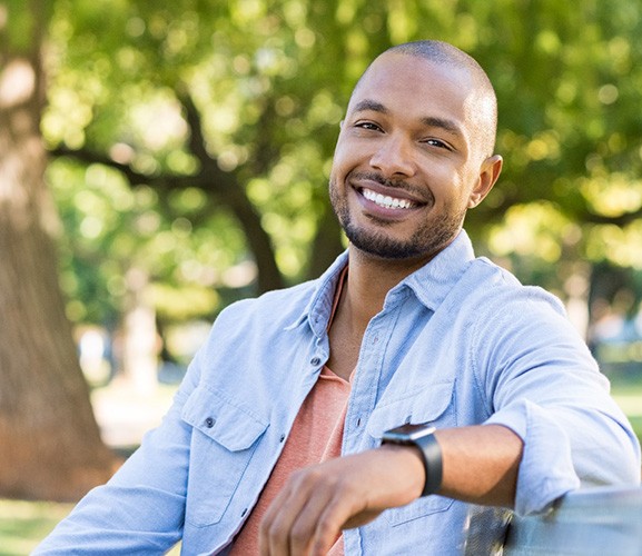 happy man with tooth-colored fillings in Dallas 