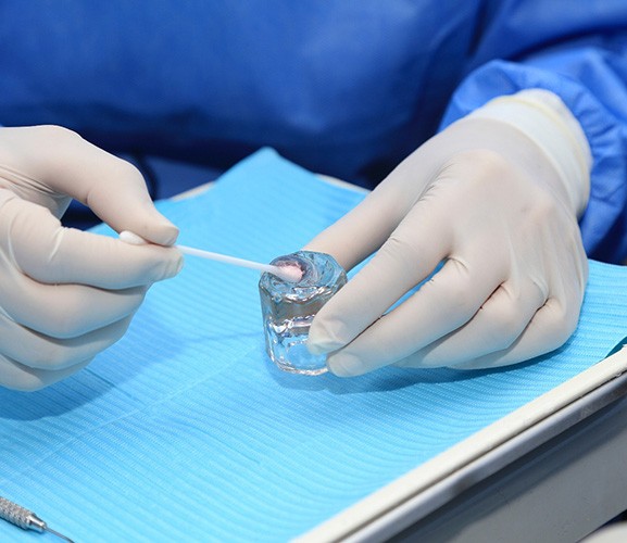 Dentist mixing up fluoride gel for application