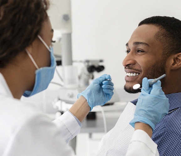 Man smiles during his Invisalign in Dallas consultation