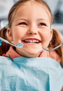 a child getting a dental checkup near Farmer’s Branch