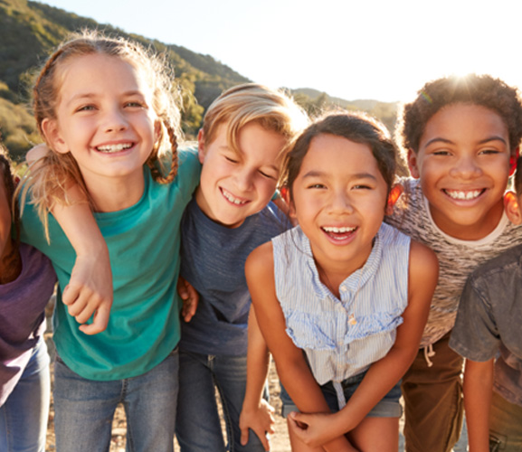 Happy group of kids playing outside