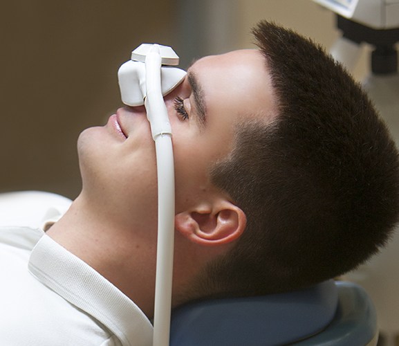 Patient with nitrous oxide dental sedation nasal mask in place