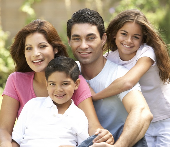 Smiling family of four