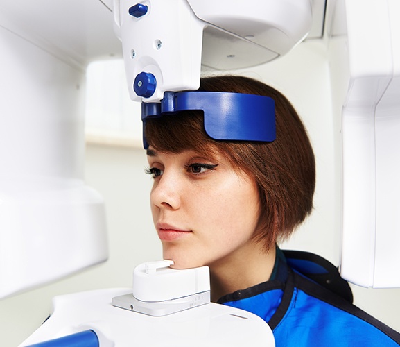 Woman receiving 3 D C T cone beam scans