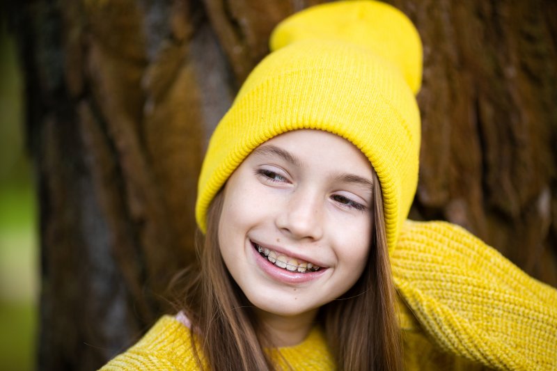 a child wearing braces and smiling