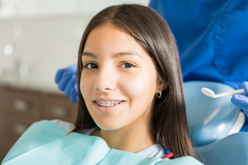 Smiling teenage girl wearing braces