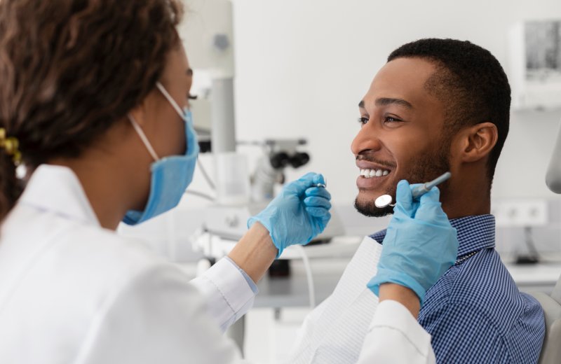 Patient smiling after their cosmetic dentistry treatments