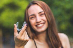 Woman starting her Invisalign treatment during summer