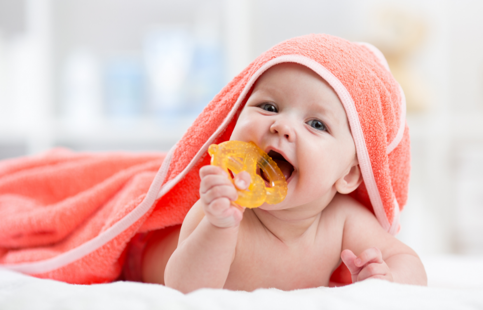 Baby with teething toy